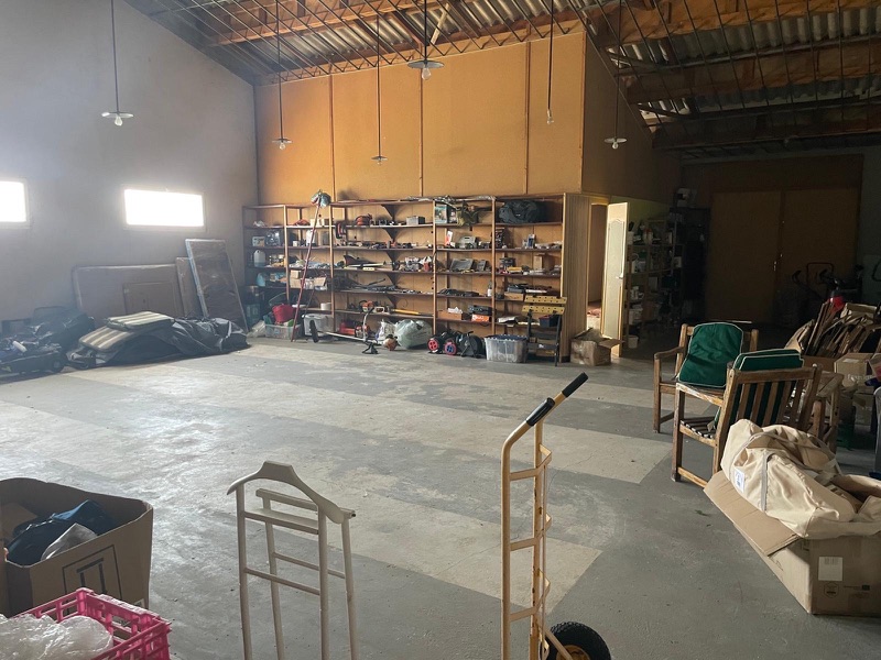 The large, structurally sound main room inside the outbuilding